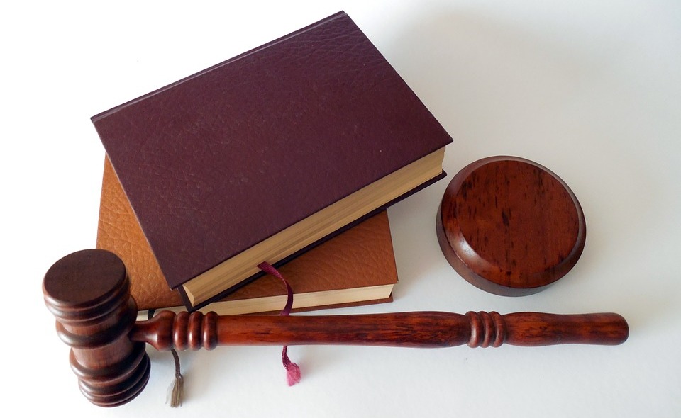 hammer with law books