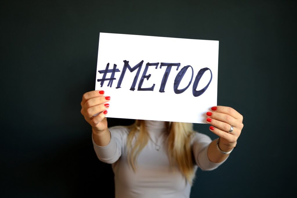 women holding #metoo card