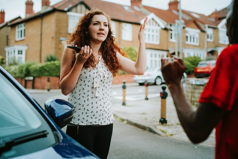 women arguing with women after car accident