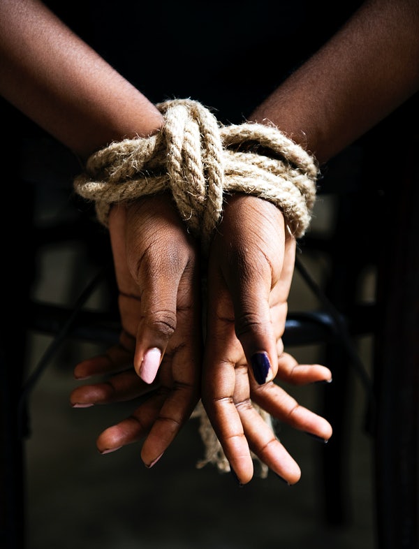 women tied up hands close up