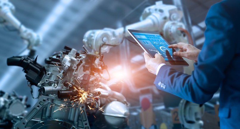 Manager engineer check and control automation robot arms machine