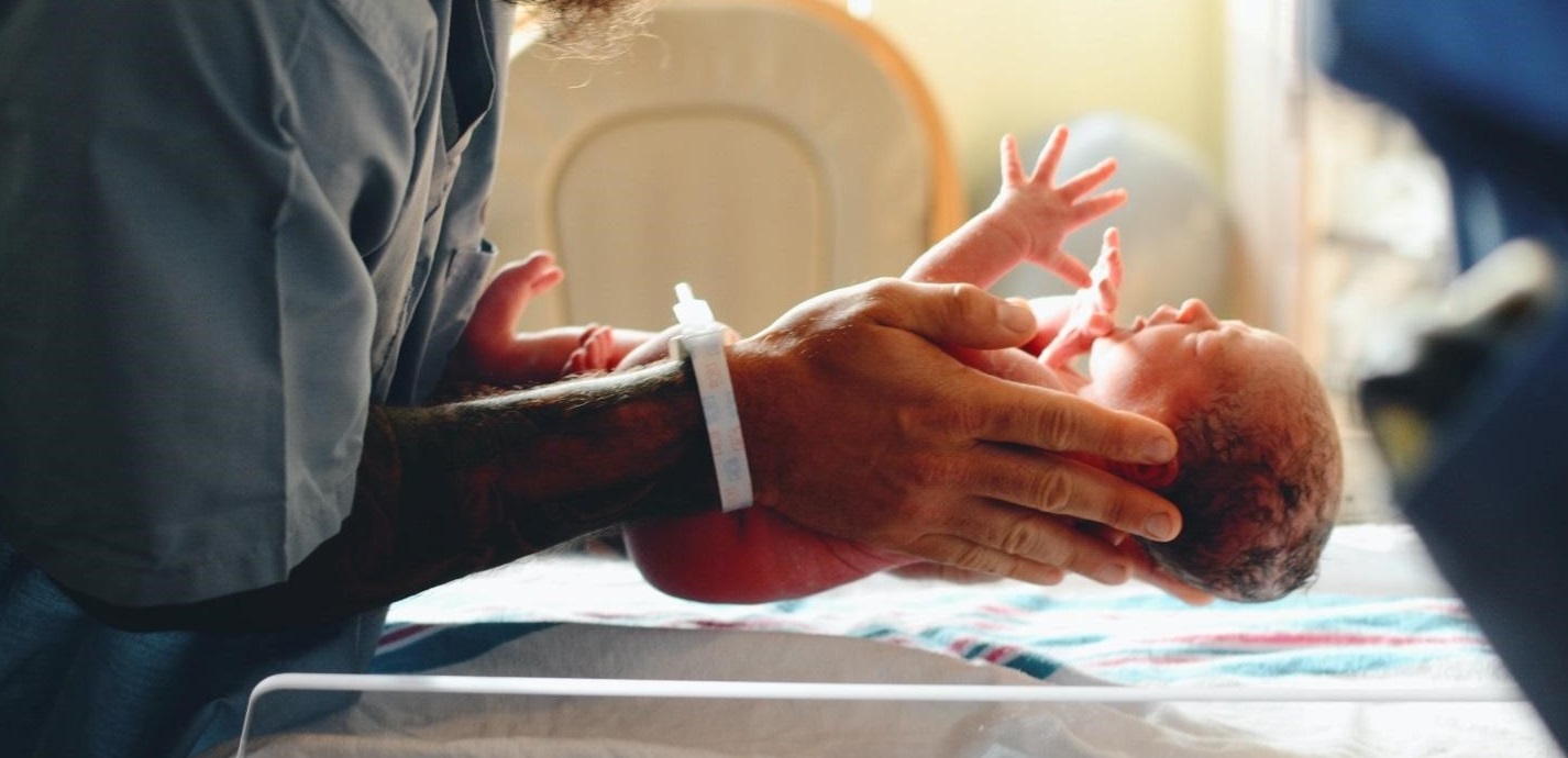 Nurse holding a newborn baby
