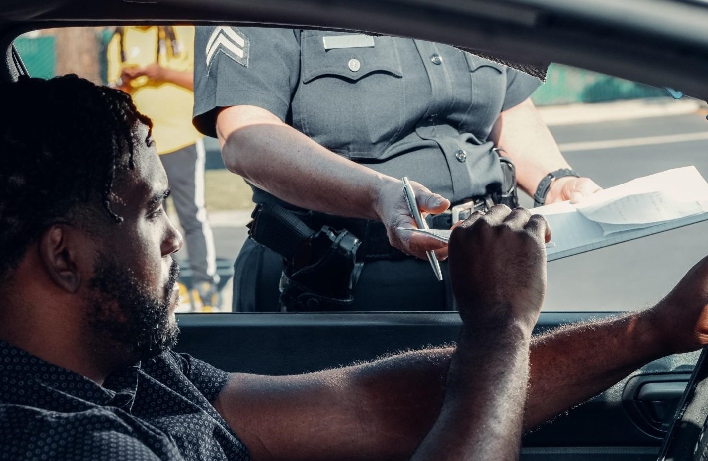 A driver pulled over by a police officer