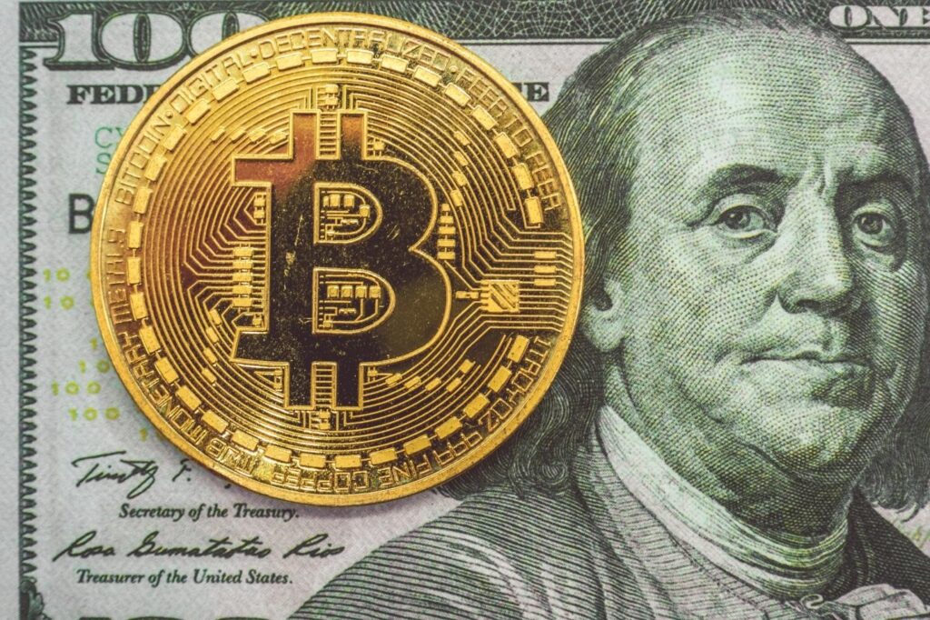 bitcoin on a hundred dollar bill