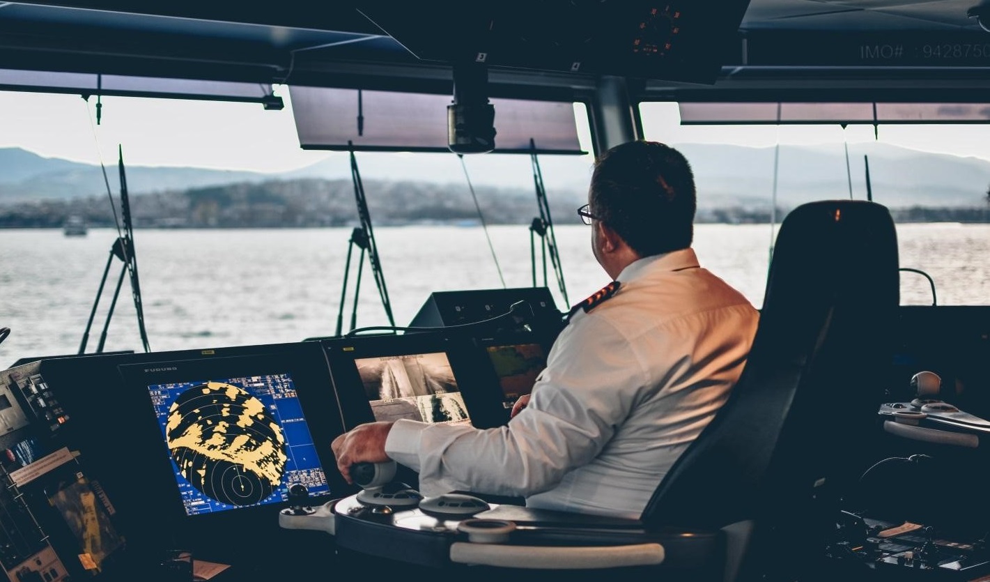 captain at the cockpit of a cruise ferry