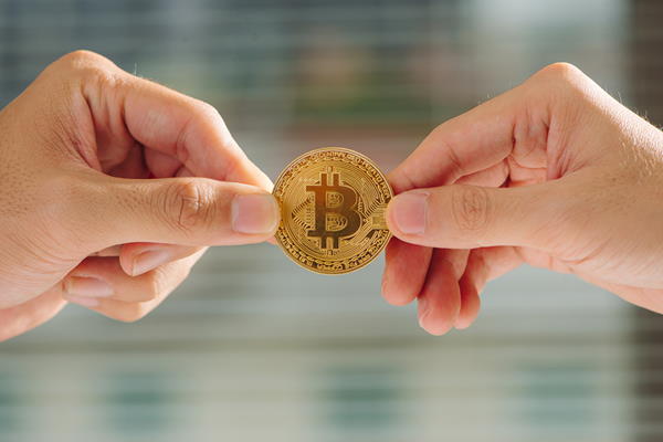 man women pulling bitcoin