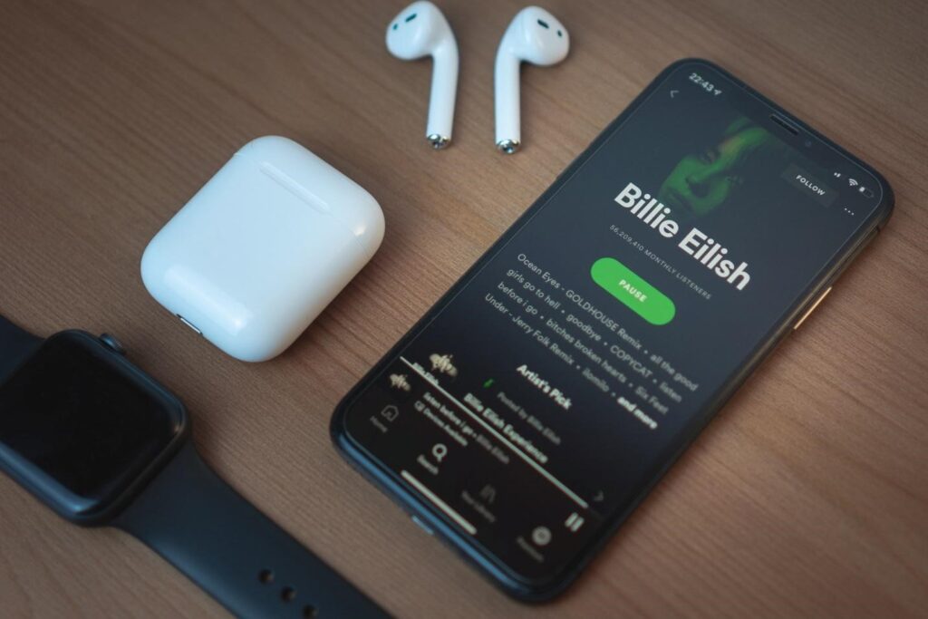 smartphone AirPods and smartwatch on a table