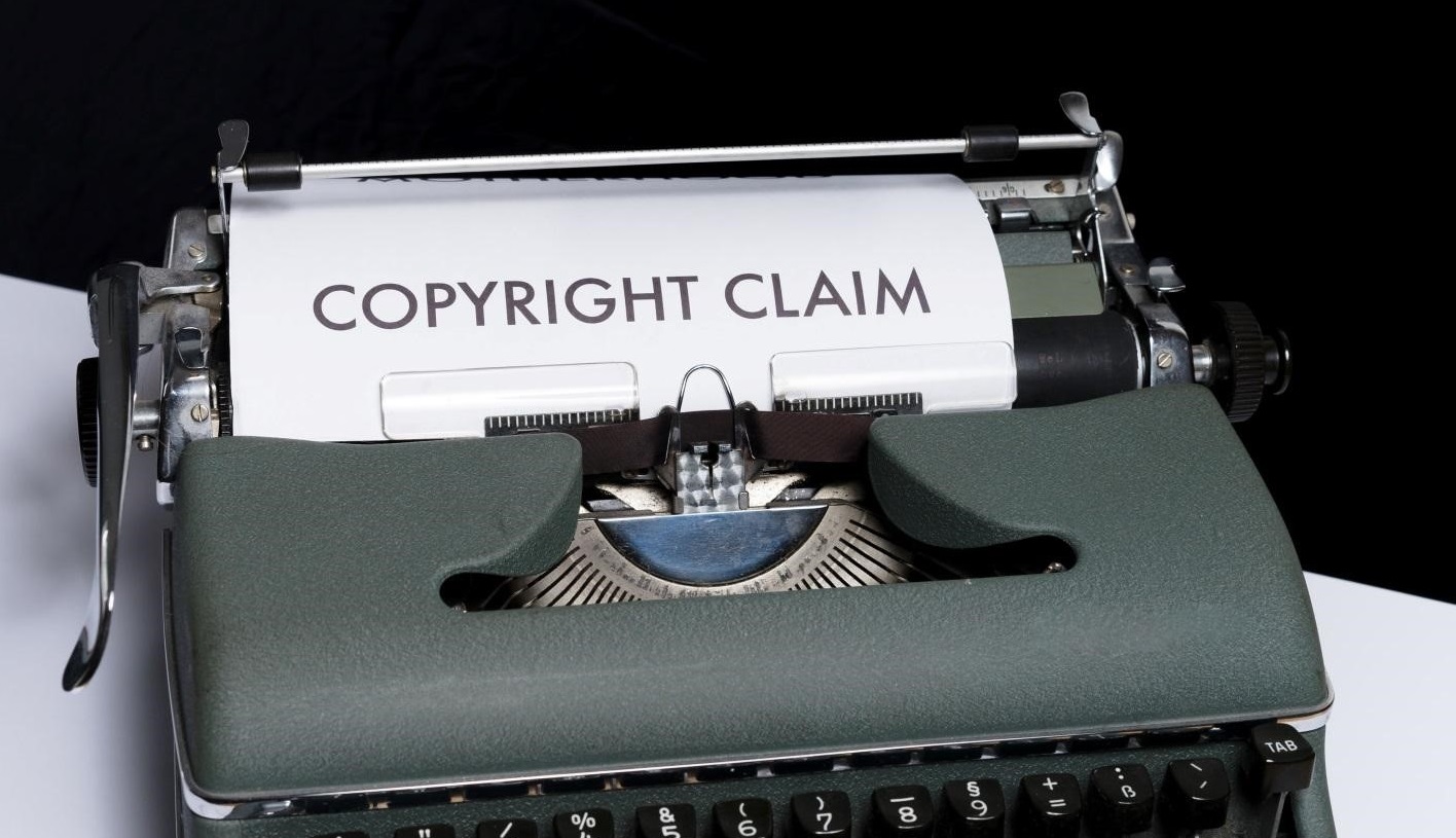 typewriter with a page displaying words